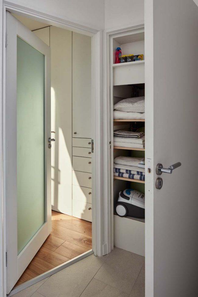 Small apartment restoration with contemporary storage solutions