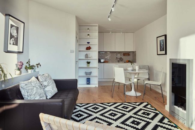 Small apartment restoration with contemporary storage solutions Open Plan Apartment